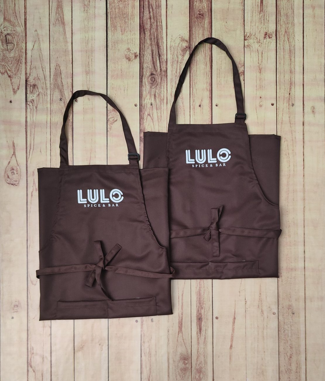 Custom waterproof and canvas aprons for restaurant kitchens, made by RestroCart