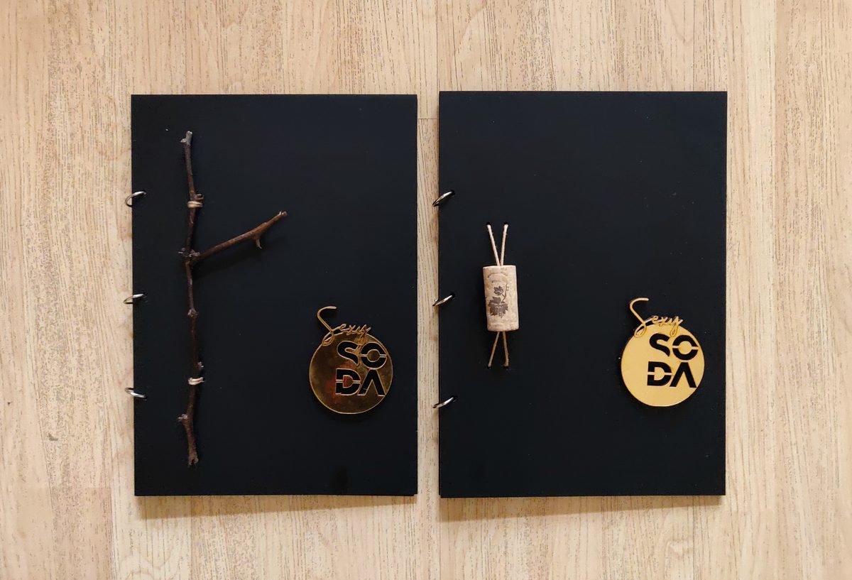 Black menu boards with wooden tags for SODA