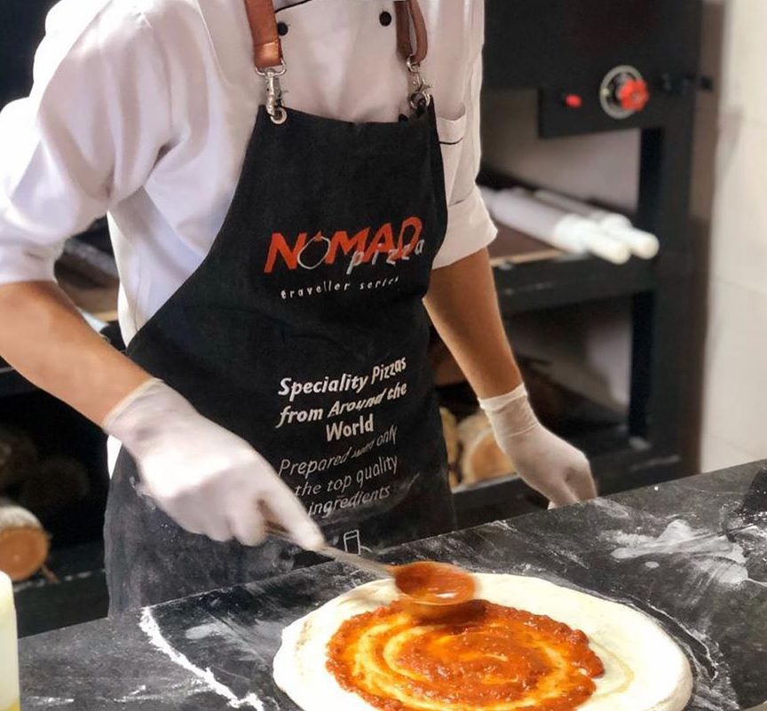 NOMAD Pizza chef apron worn during pizza prep