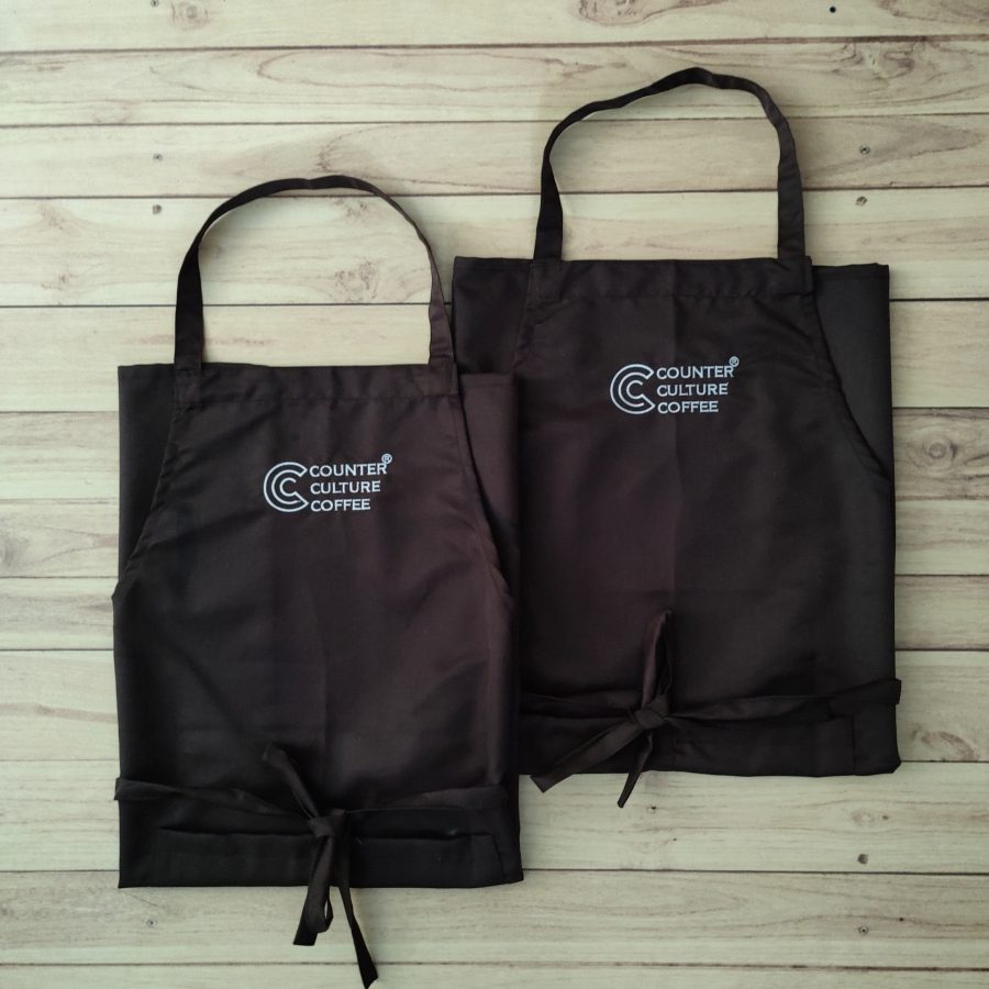 Custom cafe aprons and caps made for Counter Culture Coffee by RestroCart