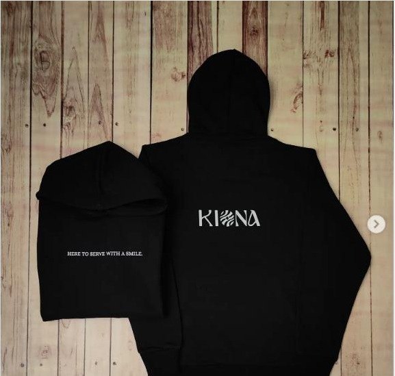 Black custom hoodies with Kiona branding and 'Here to serve with a smile' embroidery, restaurant winterwear