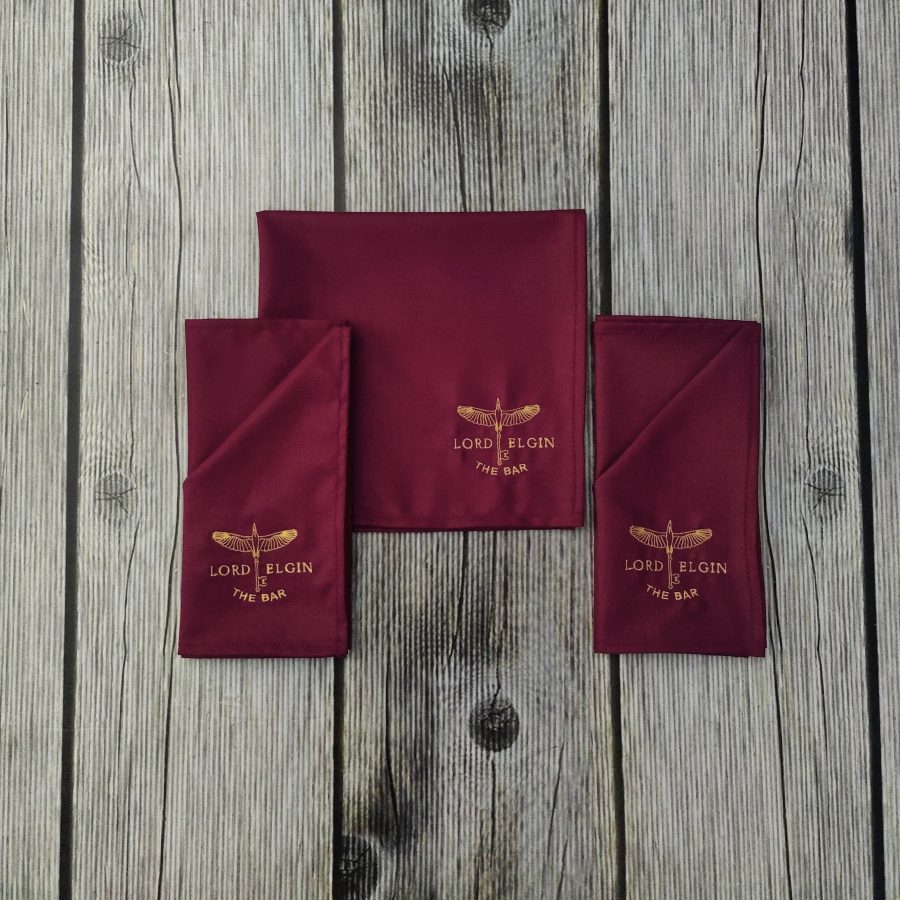 Gold-embroidered maroon table napkins made for Lord Elgin by RestroCart
