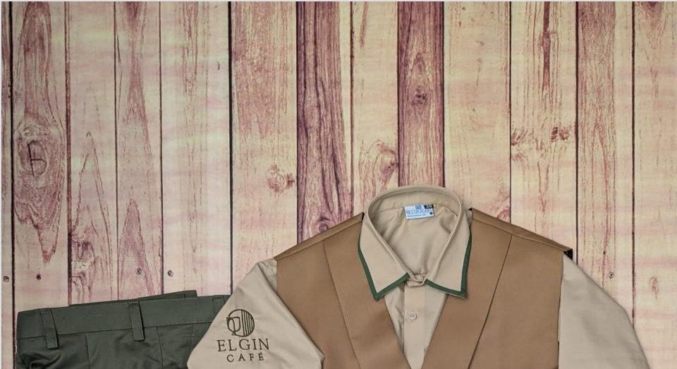 Beige tailored shirt and vest manager uniform with embroidered crest made for Elgin Cafe, Amritsar