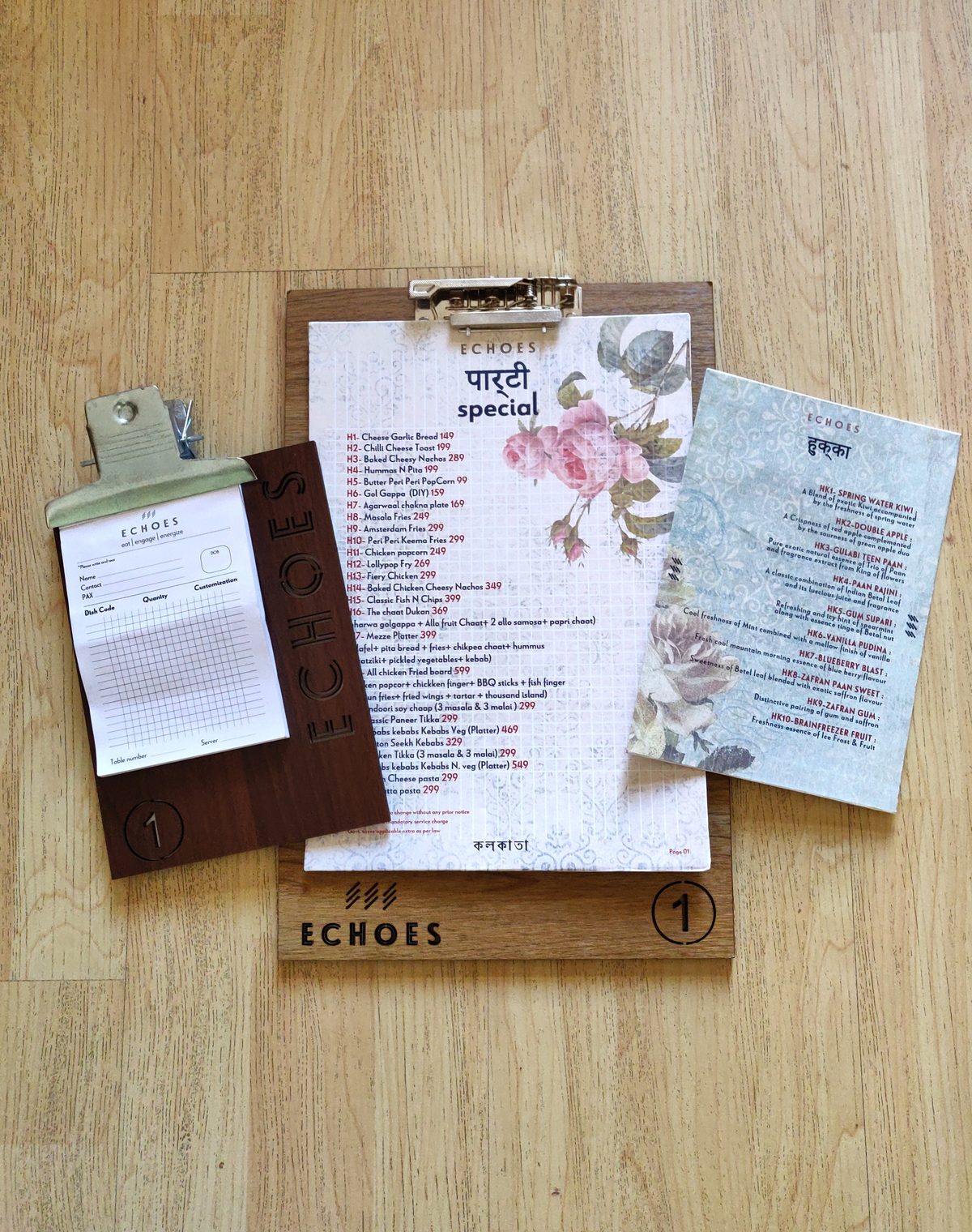 Floral menu cards and wooden clipboard for Echoes