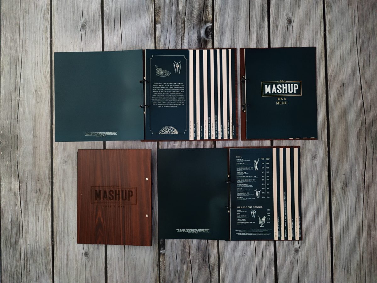 Black and green menu folders for Mashup restaurant