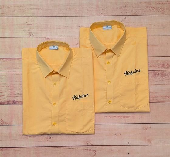 Custom uniform shirts with embroidered chest crests, restaurant uniform branding by RestroCart
